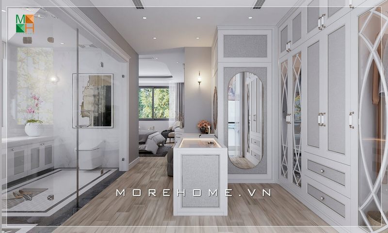Morehome xin giới thiệu cho bạn mẫu phòng ngủ phong cách tân cổ điển với phòng thay đồ ở trung tâm giúp liên kết không gian phòng ngủ với phòng tắm, tận dụng triệt để diện tích sử dụng và mang lại sự thuận tiện cho sinh hoạt hàng ngày.